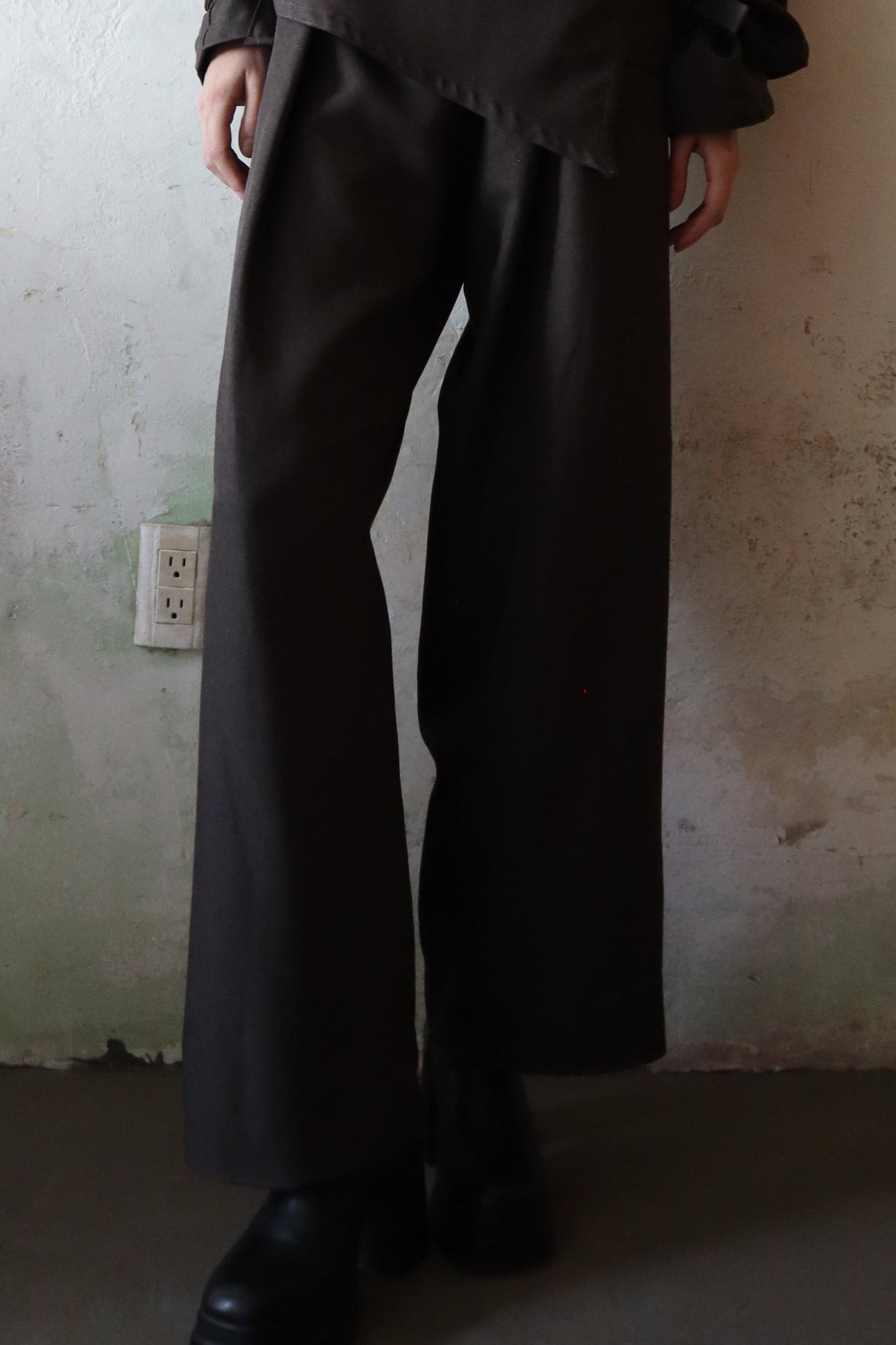 Maison Isabel Maciel asymmetrical wide leg pants with front pleats, featured in lookbook.