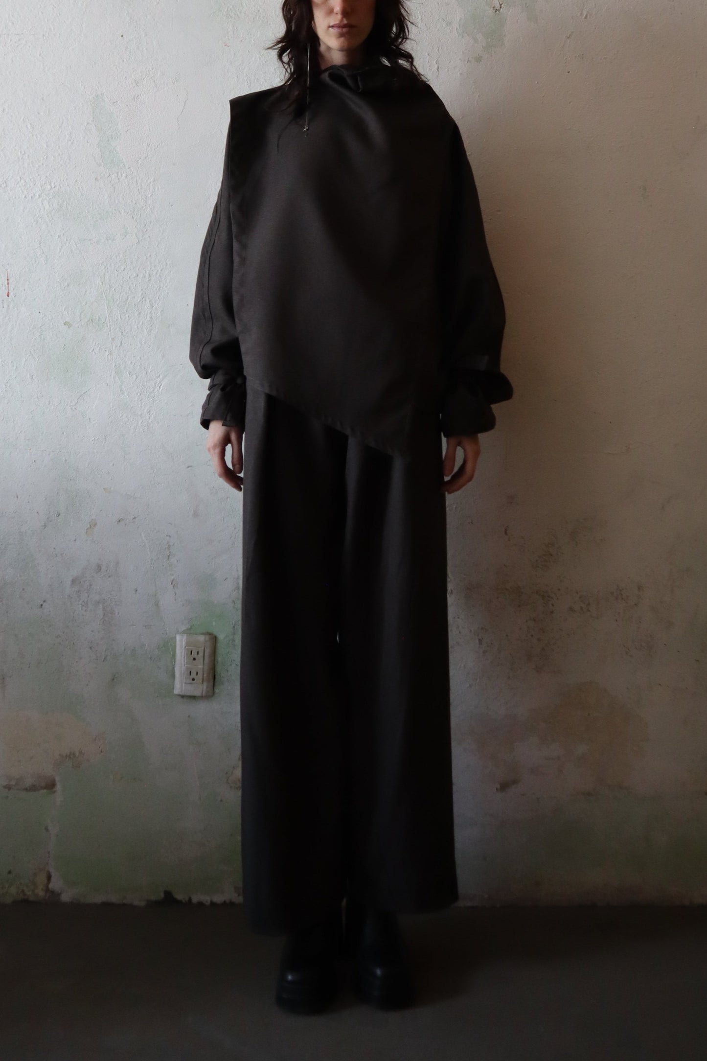Maison Isabel Maciel asymmetrical wide leg pants with front pleats, featured in lookbook.