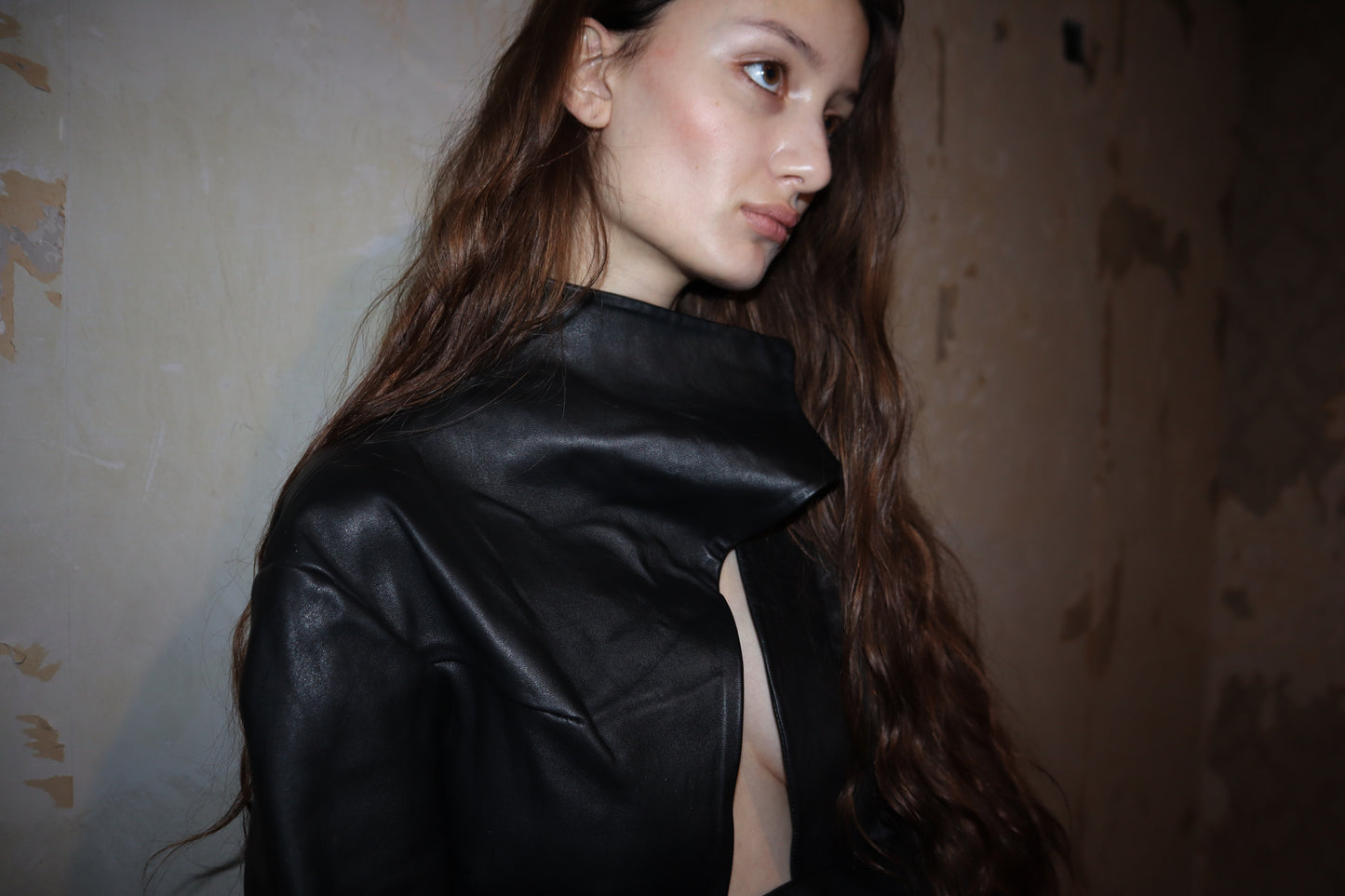 Maison Isabel Maciel - Asymmetric horse leather jacket with twisted sleeves, featured in lookbook.