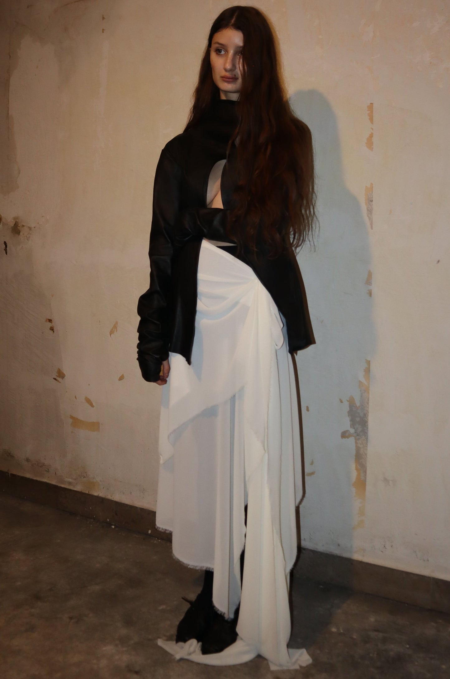 Maison Isabel Maciel - Asymmetric horse leather jacket with twisted sleeves, featured in lookbook.