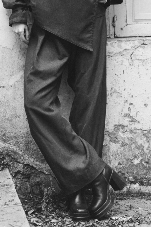 Maison Isabel Maciel asymmetrical wide leg pants with front pleats, featured in lookbook.