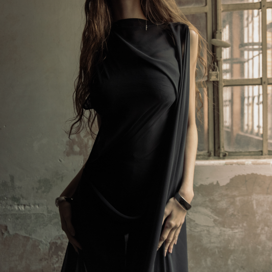 Maison Isabel Maciel hand-sewn asymmetric long dress with detailed stitching, featured in lookbook.
