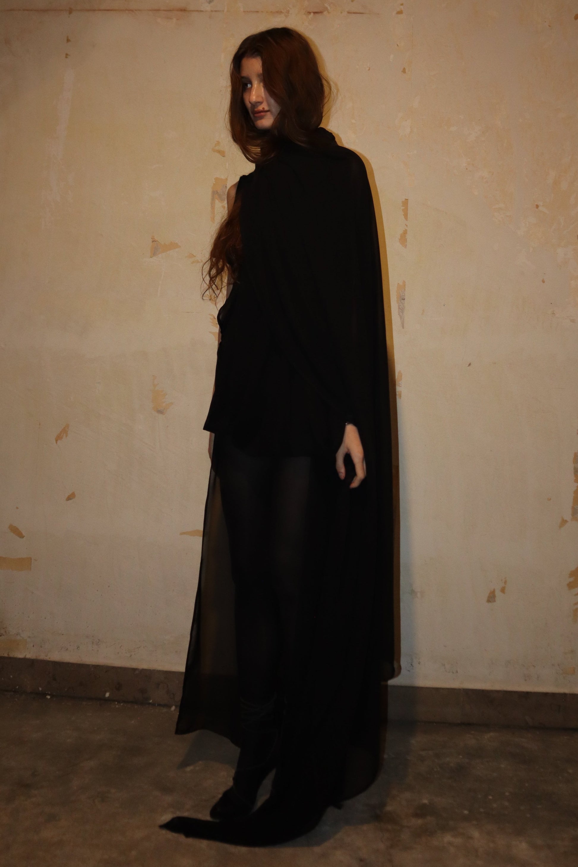 Maison Isabel Maciel hand-sewn asymmetric long dress with detailed stitching, featured in lookbook.