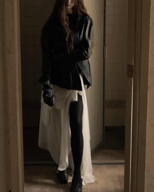 Maison Isabel Maciel - Asymmetric horse leather jacket with twisted sleeves, featured in lookbook.